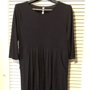 Super-flattering black pleated knit dress